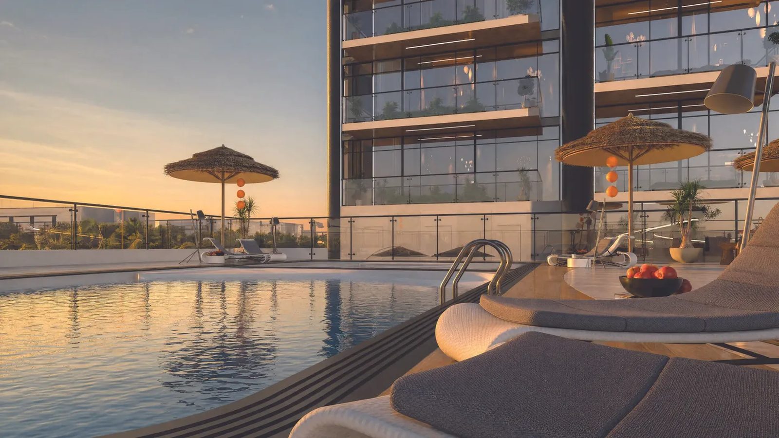 Empire Jebel Ali podium pool with sun loungers at sunset — Empire Developments render